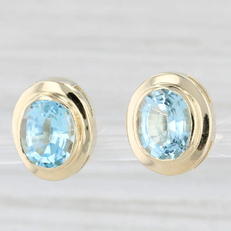 Luxury Gold Earrings For Weddings-7.30ctw Oval Blue Topaz Stud Earrings 14k Yellow Gold