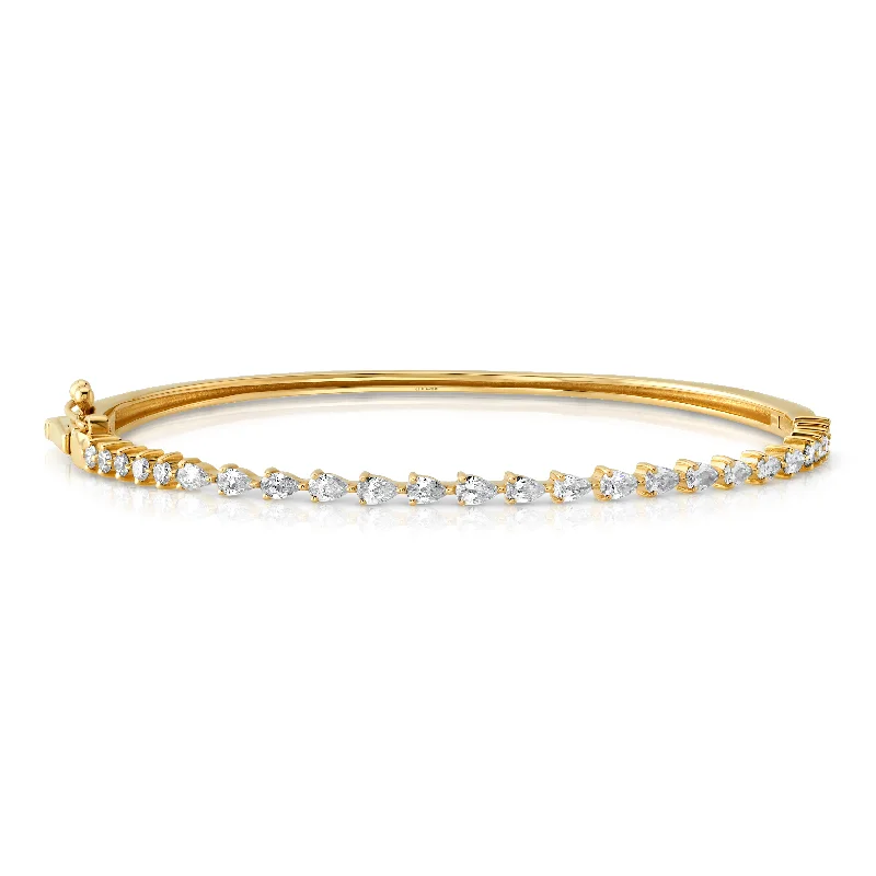 Bangles For Holiday Parties-Pear diamond bangle, 14kt gold