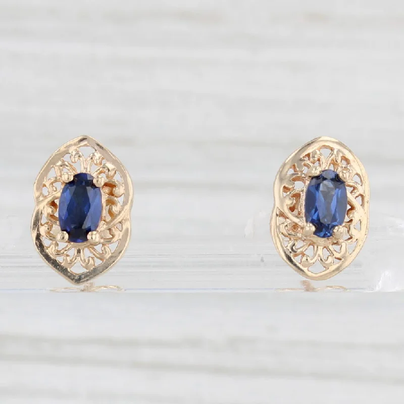 Beautiful Gemstone Earrings For Weddings-0.60ctw Lab Created Blue Sapphire Stud Earrings 10k Yellow Gold Oval Solitaires